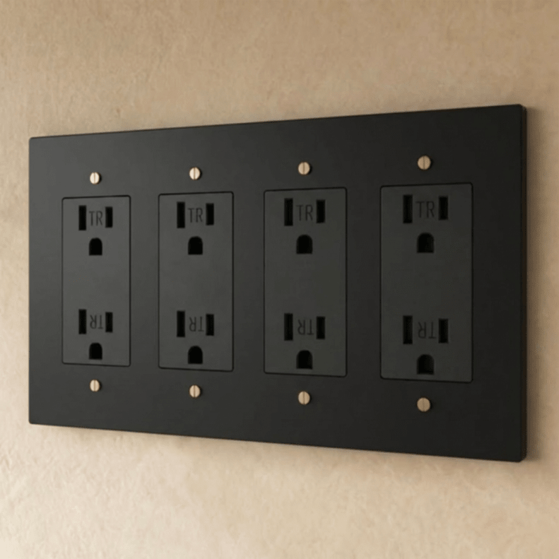 Residence Supply Brass Outlet 1 to 4 gang electrical outlet with brass finish and multiple socket openings.