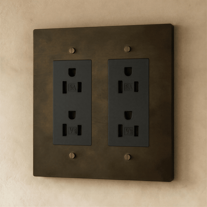 Close-up of Residence Supply Brass Outlet 1 to 4 gang electrical outlet with multiple socket openings and brass finish.