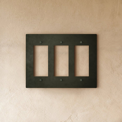 Bronze wall plate with patina finish for home and garden electrical covers, featuring a sleek brass design.
