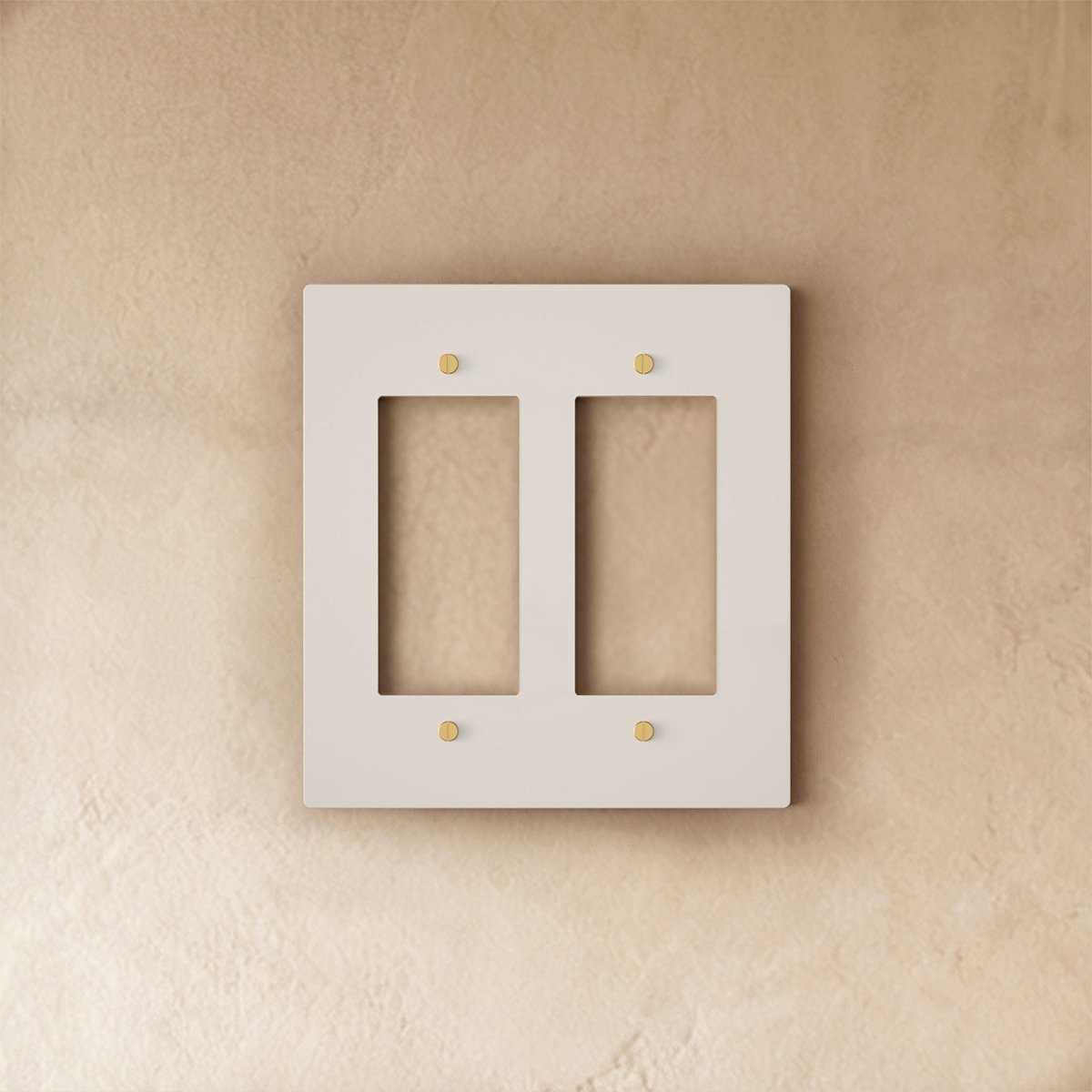 White brass wall plate from Residence Supply with brass accents, suitable for home electrical outlet or switch cover.