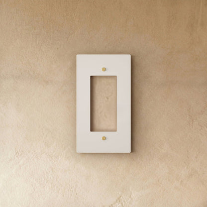 White wall plate with brass accents from Residence Supply, suitable for home electrical outlets and switches.