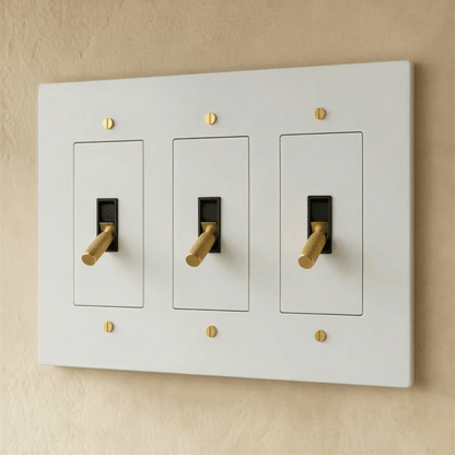 Brass toggle switch for 1 to 5 gang electrical panels, Residence Supply; showing switches with brass finish and multiple gang options.