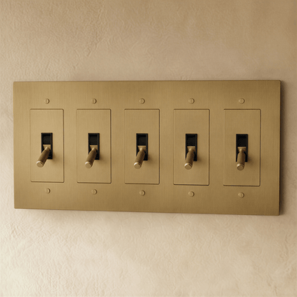 Brass toggle switch from Residence Supply with 1 to 5 gang options, shown in a close-up view of the switch mechanism.