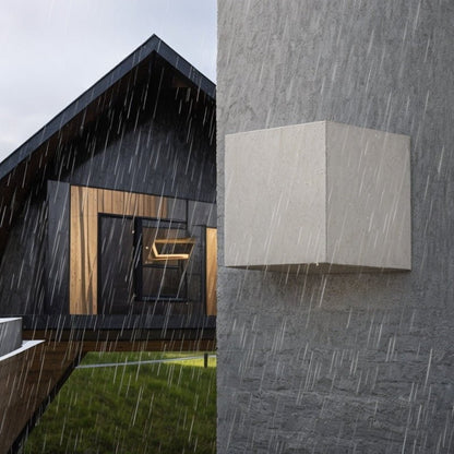 Rain-themed Tine Wall Lamp by Residence Supply featuring a sleek design and metal finish, mounted on a wall.