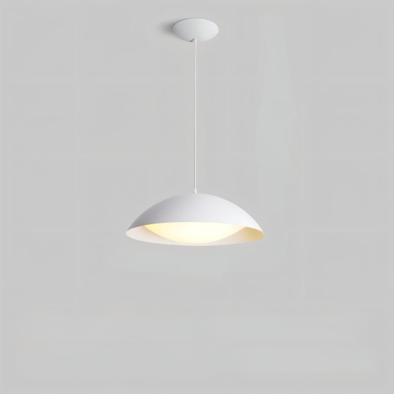 Toviel Pendant Light by Residence Supply featuring a sleek, modern metal design hanging from a ceiling fixture.