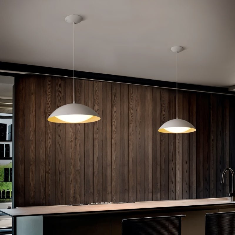 Toviel Pendant Light by Residence Supply hanging from ceiling with a modern design and metal finish in a contemporary interior setting.