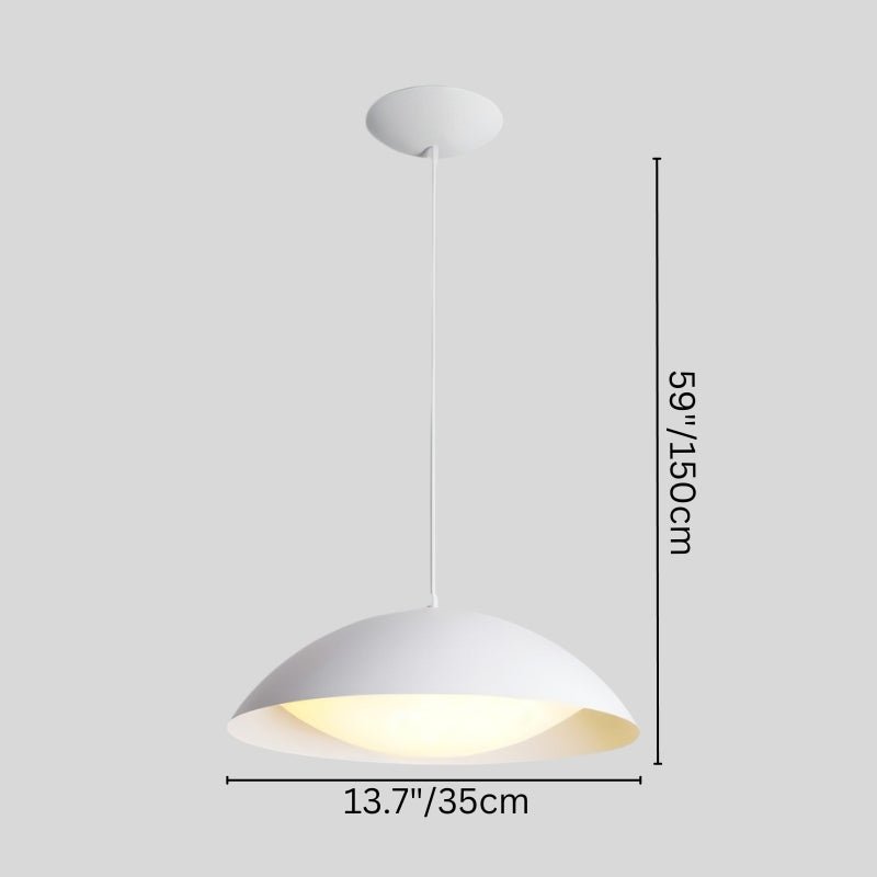 Toviel pendant light by Residence Supply hanging from ceiling, with a sleek modern design and a warm light glow.