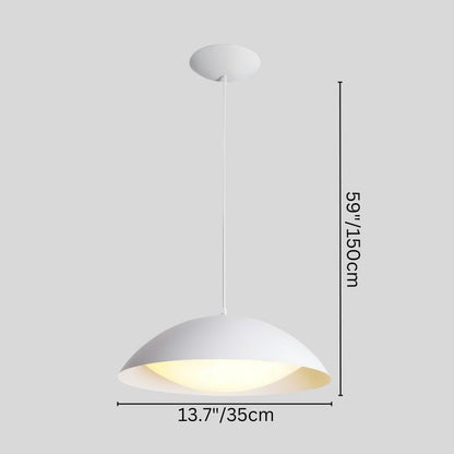 Toviel pendant light by Residence Supply hanging from ceiling, with a sleek modern design and a warm light glow.