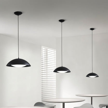 Toviel pendant light by Residence Supply featuring a modern design with a sleek metal finish and a glass shade hanging from the ceiling.