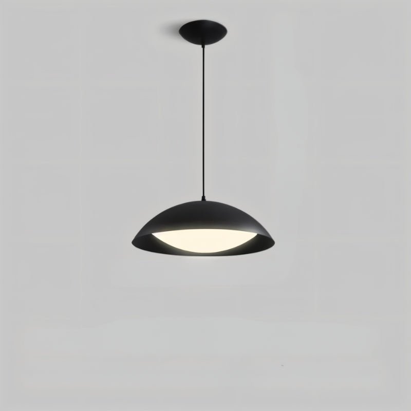 Toviel pendant light by Residence Supply hanging from ceiling, featuring a sleek modern design with a metal finish.