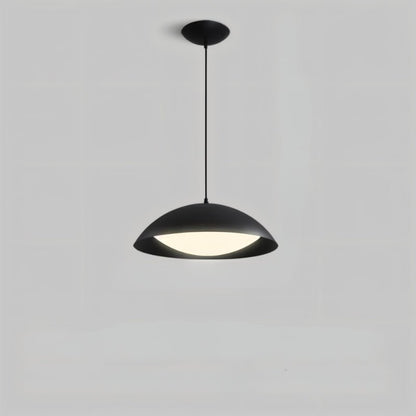 Toviel pendant light by Residence Supply hanging from ceiling, featuring a sleek modern design with a metal finish.