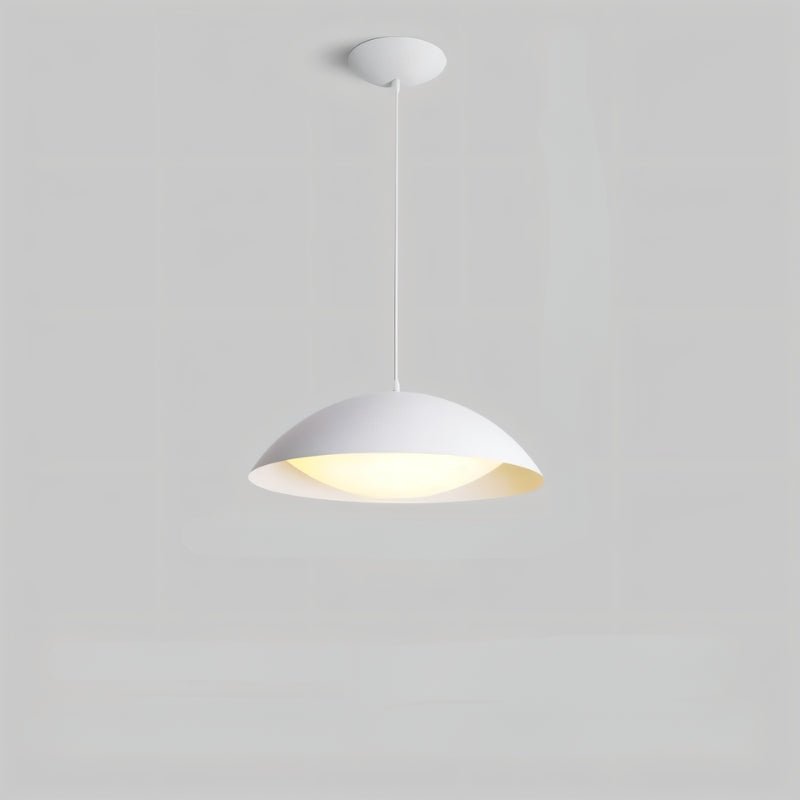 Toviel pendant light by Residence Supply hanging from ceiling with a sleek, modern design in a contemporary setting.