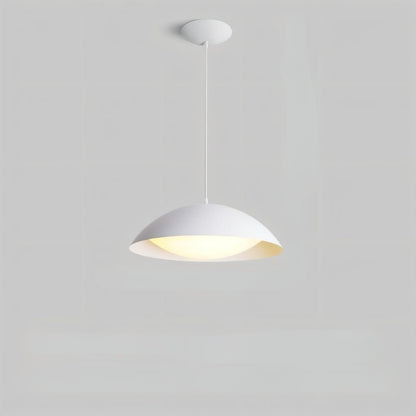 Toviel pendant light by Residence Supply hanging from ceiling with a sleek, modern design in a contemporary setting.
