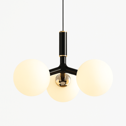 Residence Supply Trilume pendant light with a sleek metal fixture and clear glass shade hanging from a ceiling mount