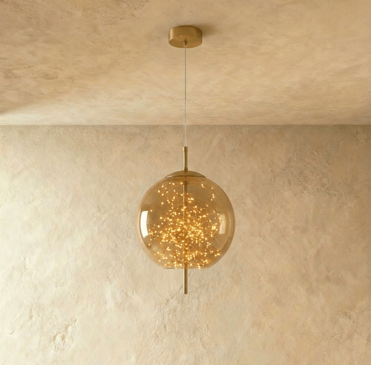Residence Supply Twirl Pendant Light with swirling metal design hanging from ceiling fixture.