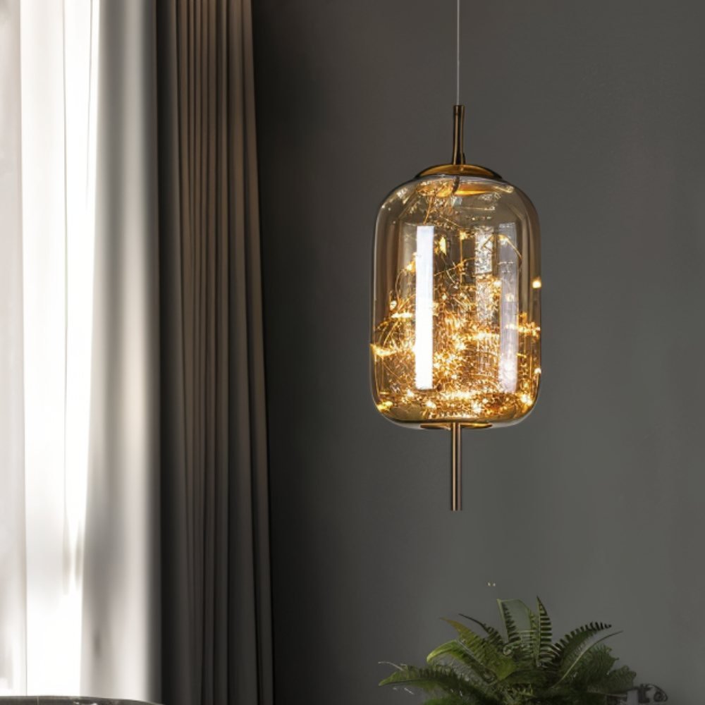 Residence Supply Twirl Pendant Light hanging fixture with a sleek, modern design and swirling metal details.