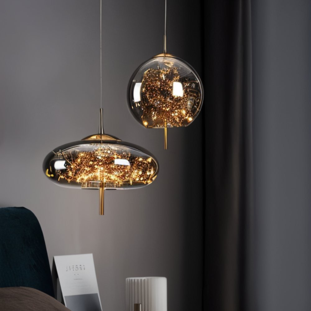 Residence Supply Twirl Pendant Light hanging fixture with a modern, sculptural design and metallic finish.