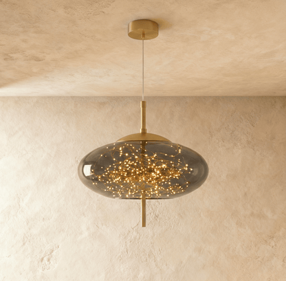 Residence Supply Twirl Pendant Light with swirling metal design hanging from ceiling in a modern interior.
