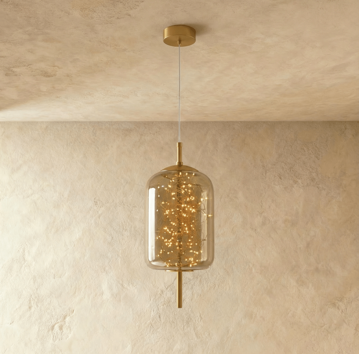Modern Twirl Pendant Light by Residence Supply with sleek, swirling design hanging from a ceiling mount.