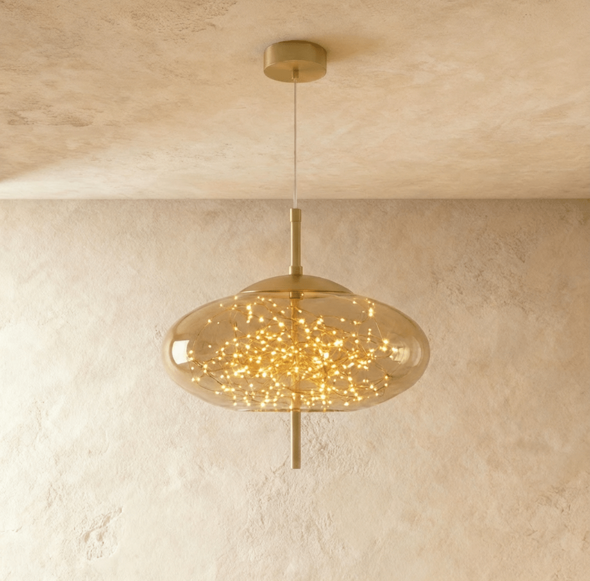 Modern Twirl Pendant Light by Residence Supply featuring a sleek, spiral design hanging from a ceiling mount.