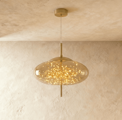 Modern Twirl Pendant Light by Residence Supply featuring a sleek, spiral design hanging from a ceiling mount.