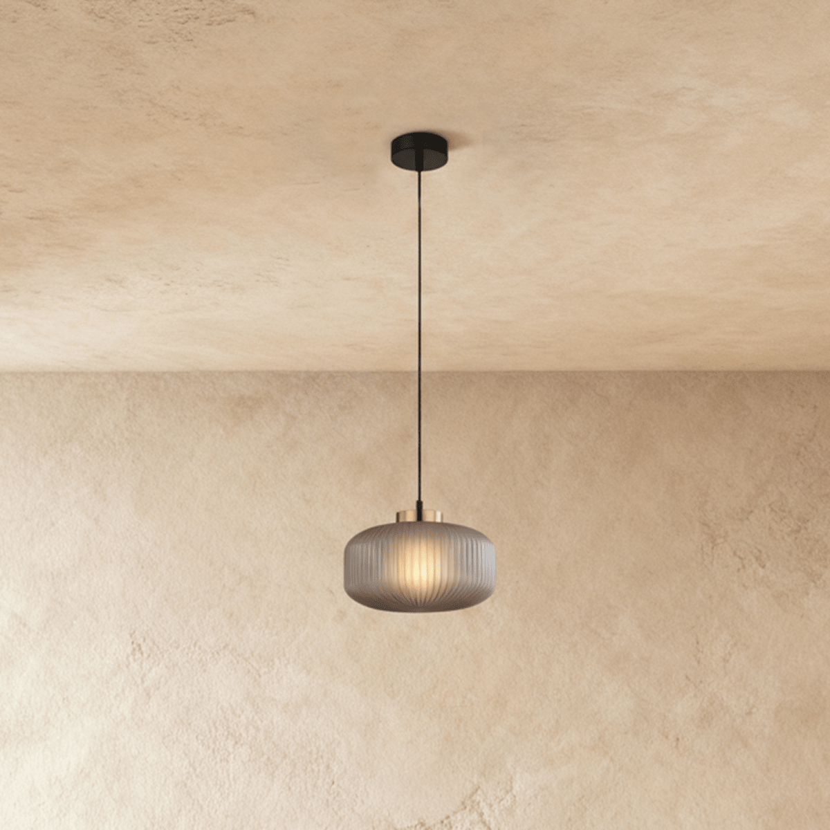 Vahni Pendant Light by Residence Supply hanging from ceiling with a sleek modern design and warm ambient lighting.