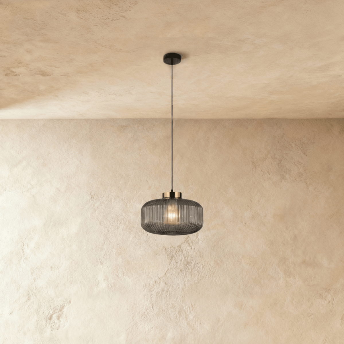 Modern Vahni Pendant Light by Residence Supply featuring a sleek metal design with a clear glass shade.