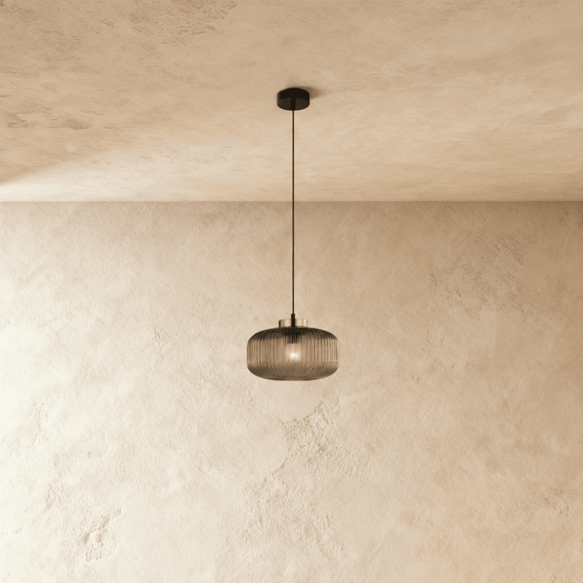 Vahni Pendant Light by Residence Supply hanging from ceiling with a sleek, modern design and warm lighting effect.