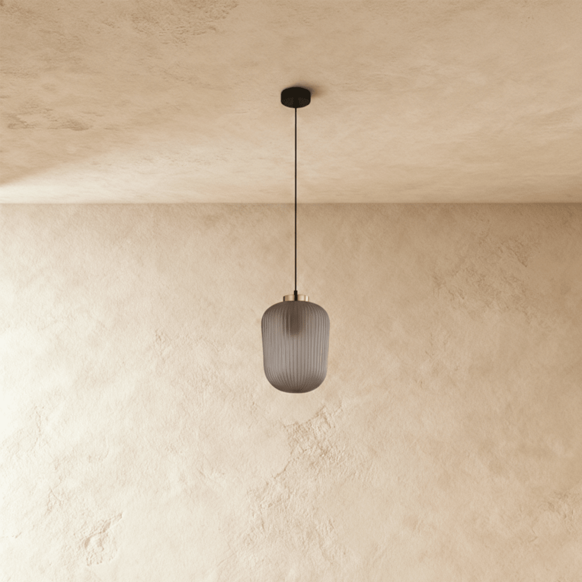 Vahni Pendant Light by Residence Supply hanging from ceiling with a sleek modern design and metal finish.
