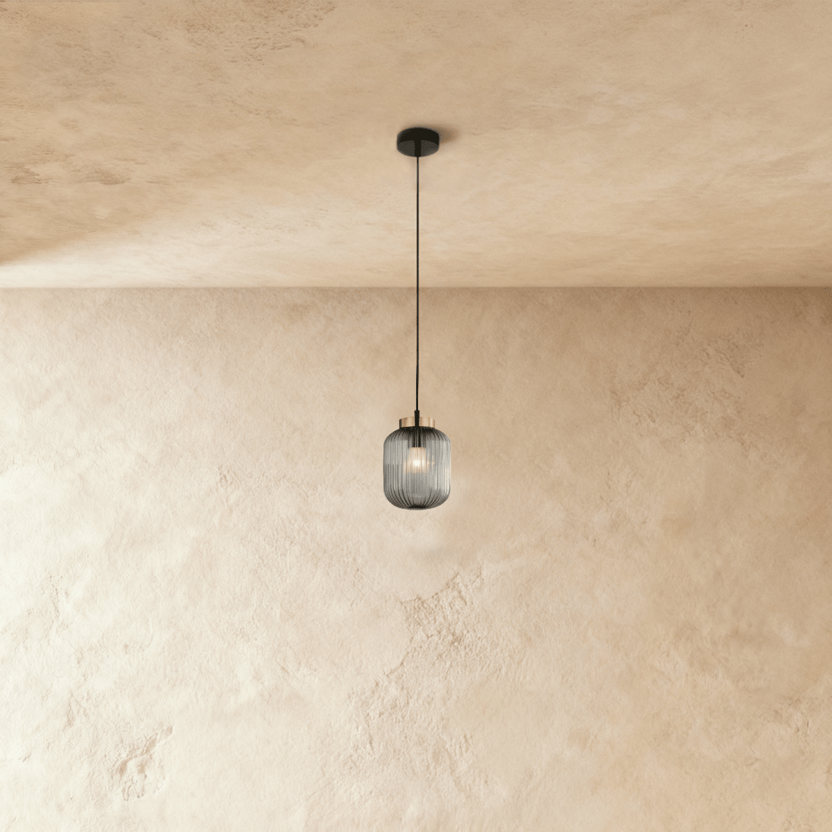 Modern Vahni Pendant Light by Residence Supply with a sleek design, hanging from a ceiling fixture in a contemporary interior setting.