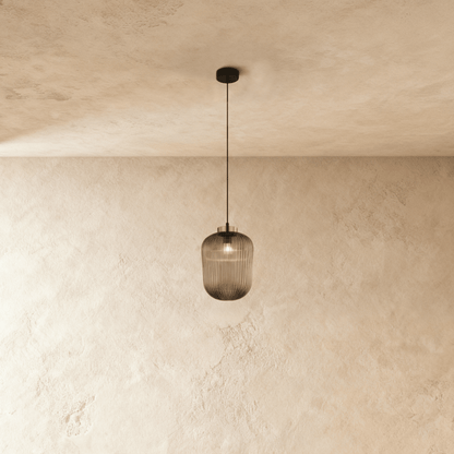 Vahni Pendant Light by Residence Supply hanging from ceiling with a modern design and warm glow, ideal for contemporary interiors.