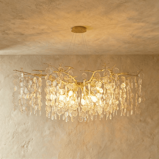 Elegant Velora chandelier by Residence Supply featuring intricate metalwork and multiple hanging glass bulbs.