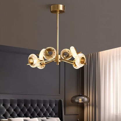 Modern glass chandelier by Residence Supply, featuring a sleek design suitable for bedroom lighting.