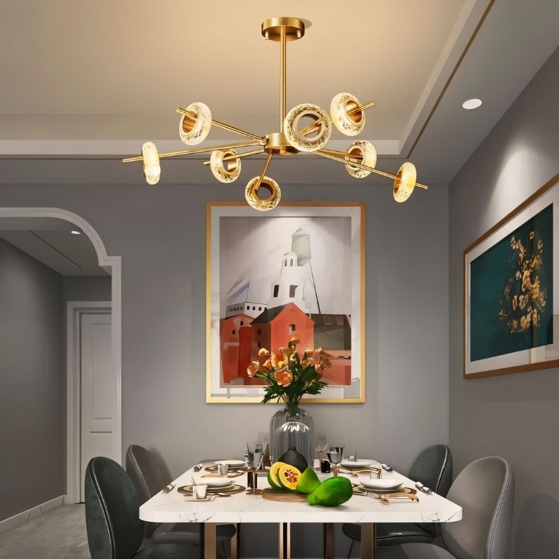 Modern Volrin chandelier with glass design hanging above a dining room table in a contemporary space.