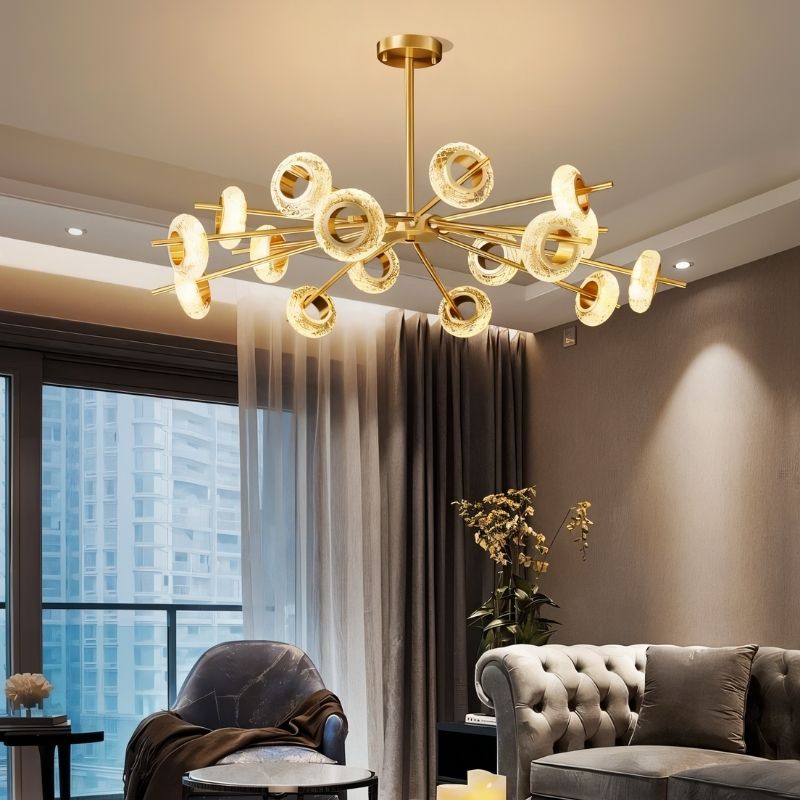 Modern Volrin Chandelier by Residence Supply hanging in a stylish living room with city view, featuring glass design and contemporary lighting.