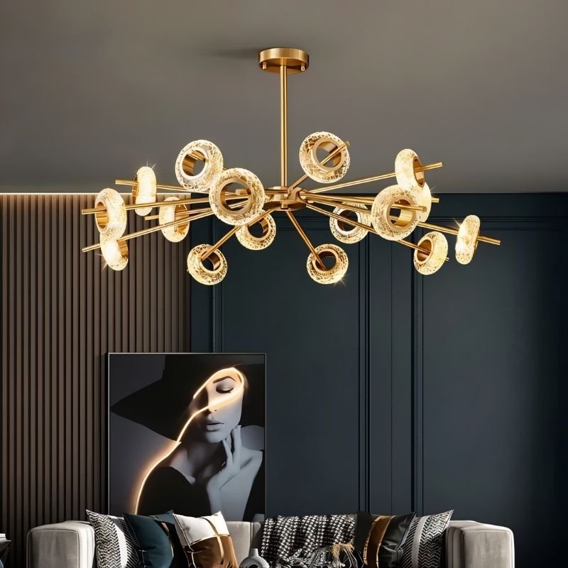Modern Volrin Chandelier by Residence Supply with glass fixtures, hanging over a stylish living room.