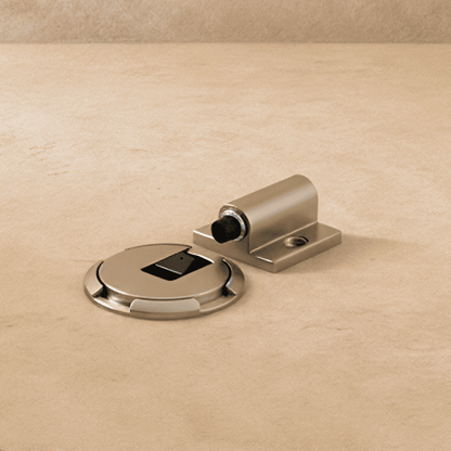 Residence Supply Walik door stop mounted on a wall, made of metal, used to prevent door damage and keep doors open.