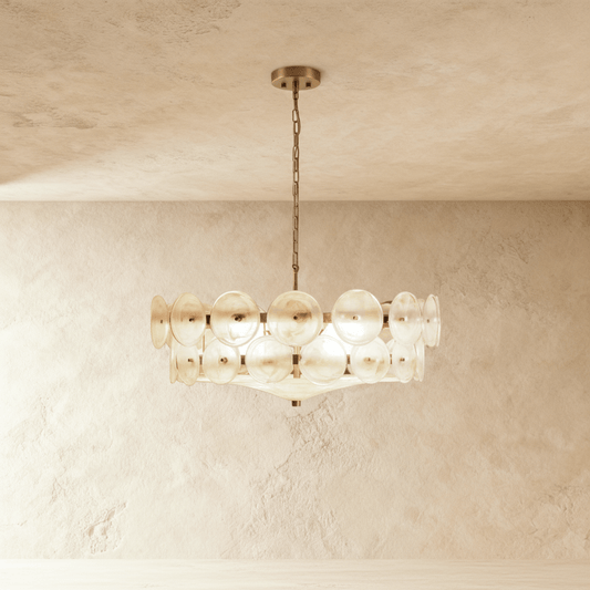 Wamble chandelier by Residence Supply featuring multiple glass globes and a sleek metal frame, hanging from a ceiling fixture.