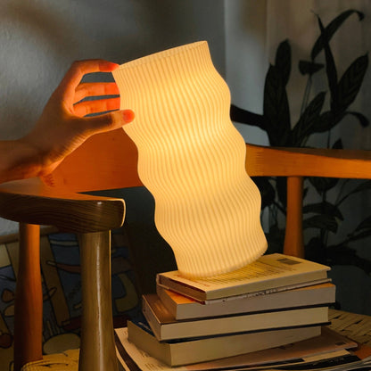 Terra Labs Wub Table Lamp with a modern, rounded design and soft glow, ideal for contemporary home or office decor.