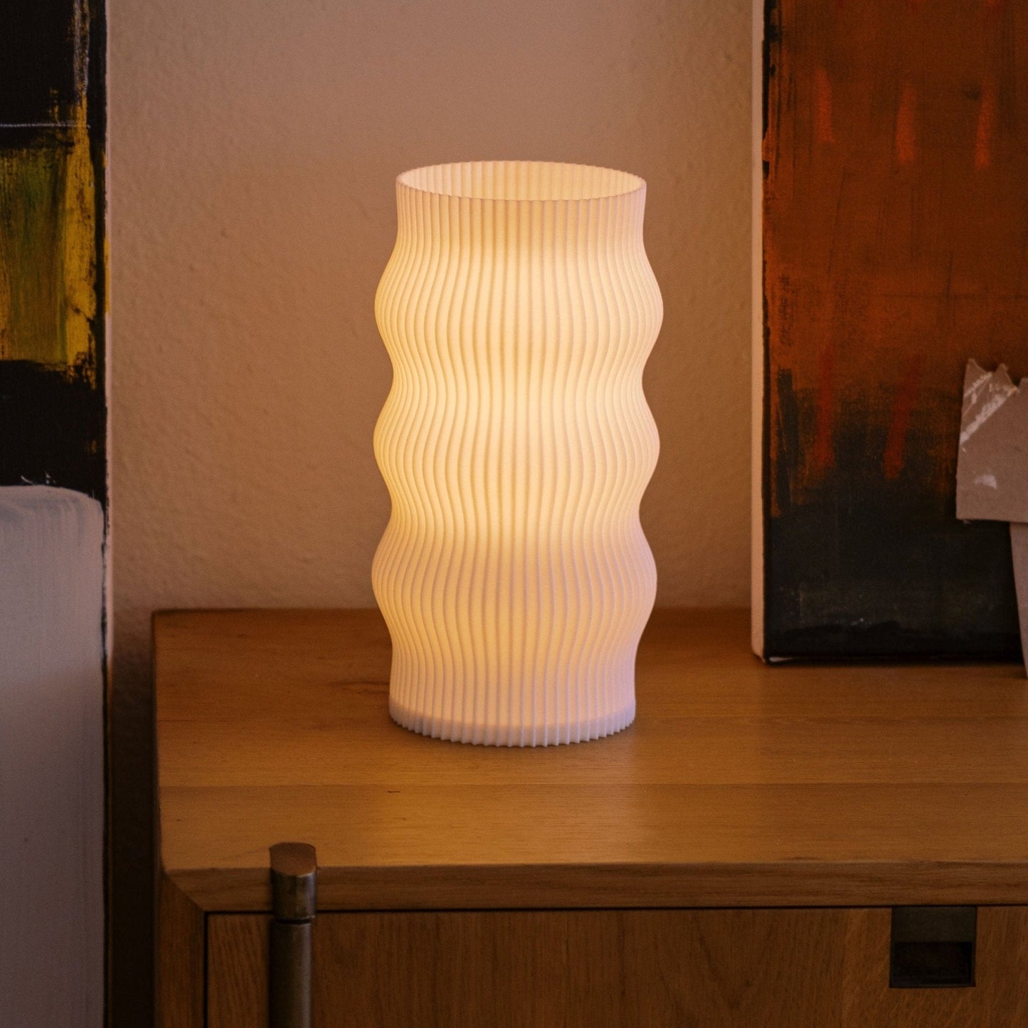 Terra Labs Wub Table Lamp with rounded shape and soft glowing light, perfect for modern home decor.