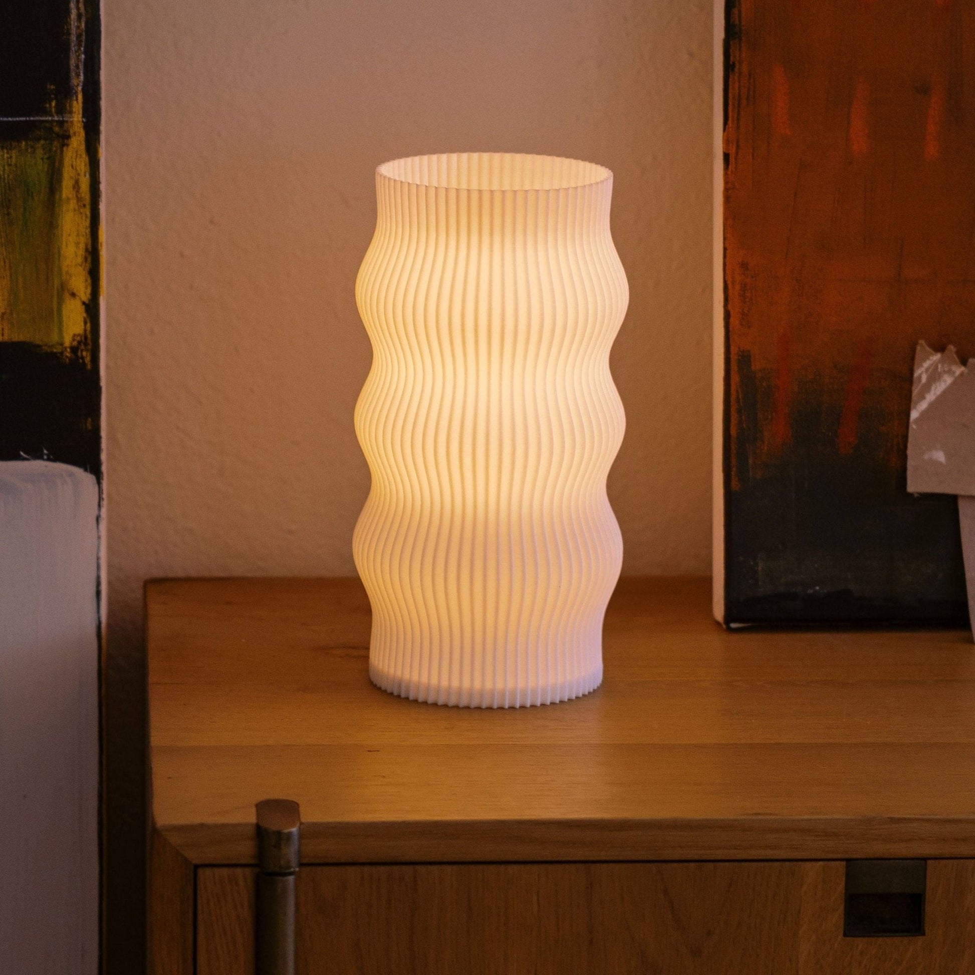 Terra Labs Wub Table Lamp with rounded shape and soft glowing light, perfect for modern home decor.