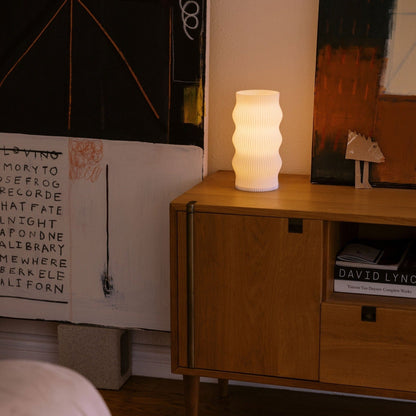 Terra Labs Wub table lamp featuring a modern design with a rounded shape and soft lighting for contemporary home decor.