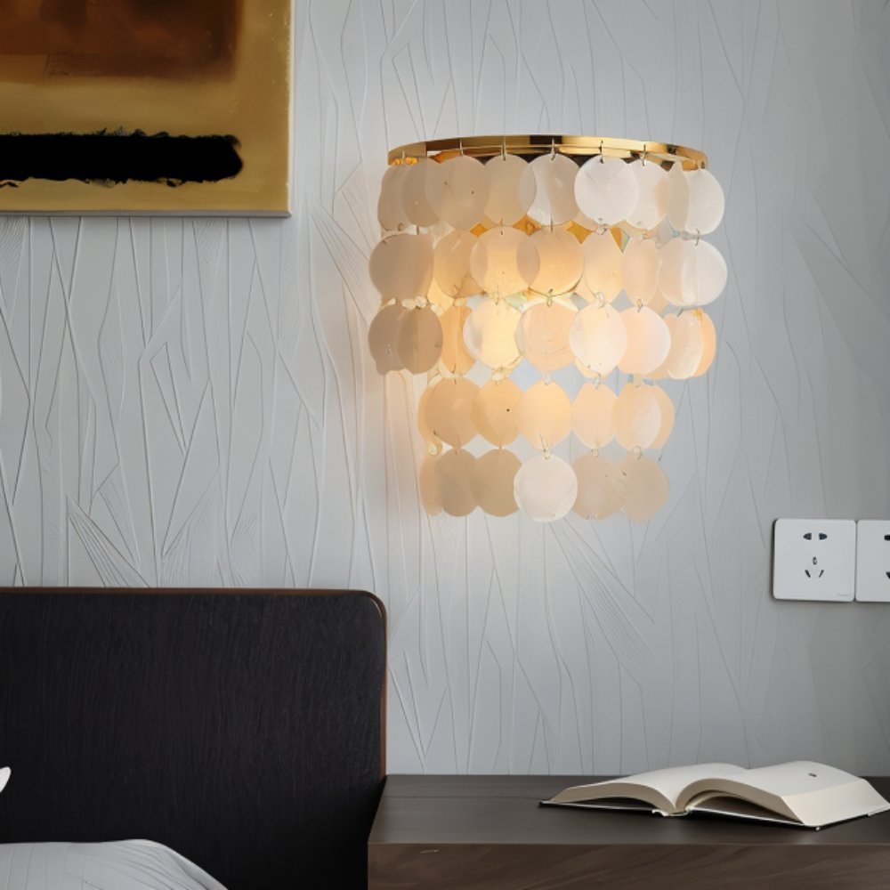 Residence Supply Xandor Wall Lamp mounted on a wall, featuring modern design with a sleek metal finish and ambient lighting.
