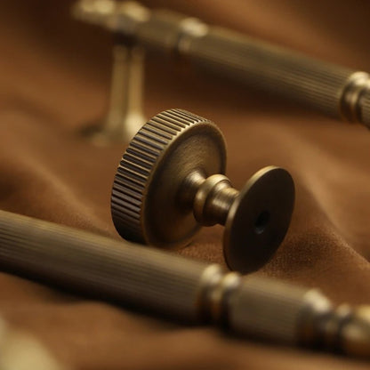 Yasha knob and pull bar from Residence Supply, cabinet hardware for home furniture, featuring a sleek metallic finish.