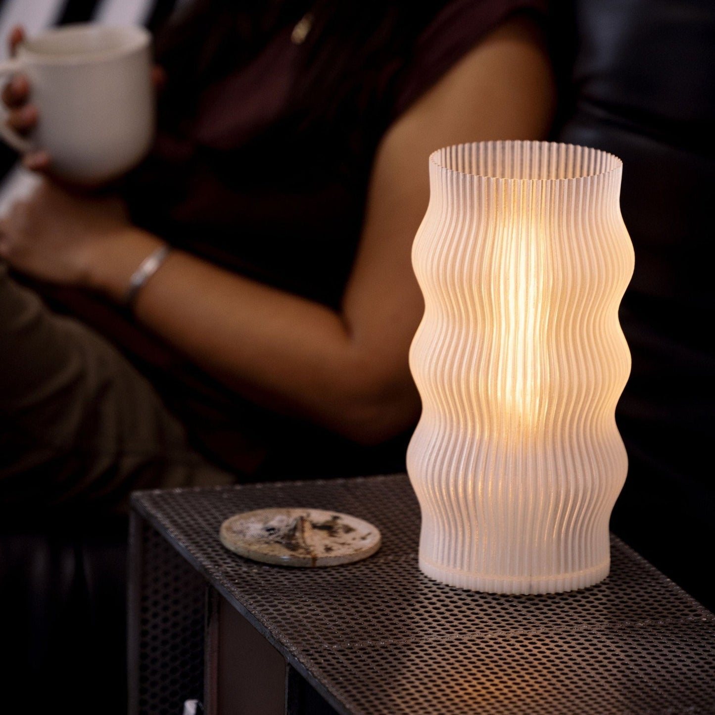 Terra Labs Yuji table lamp with a sleek modern design, featuring a cylindrical base and a fabric lampshade.
