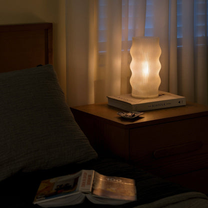 Terra Labs Yuji table lamp featuring a modern design with a sleek base and soft white lampshade, ideal for bedside or desk lighting.