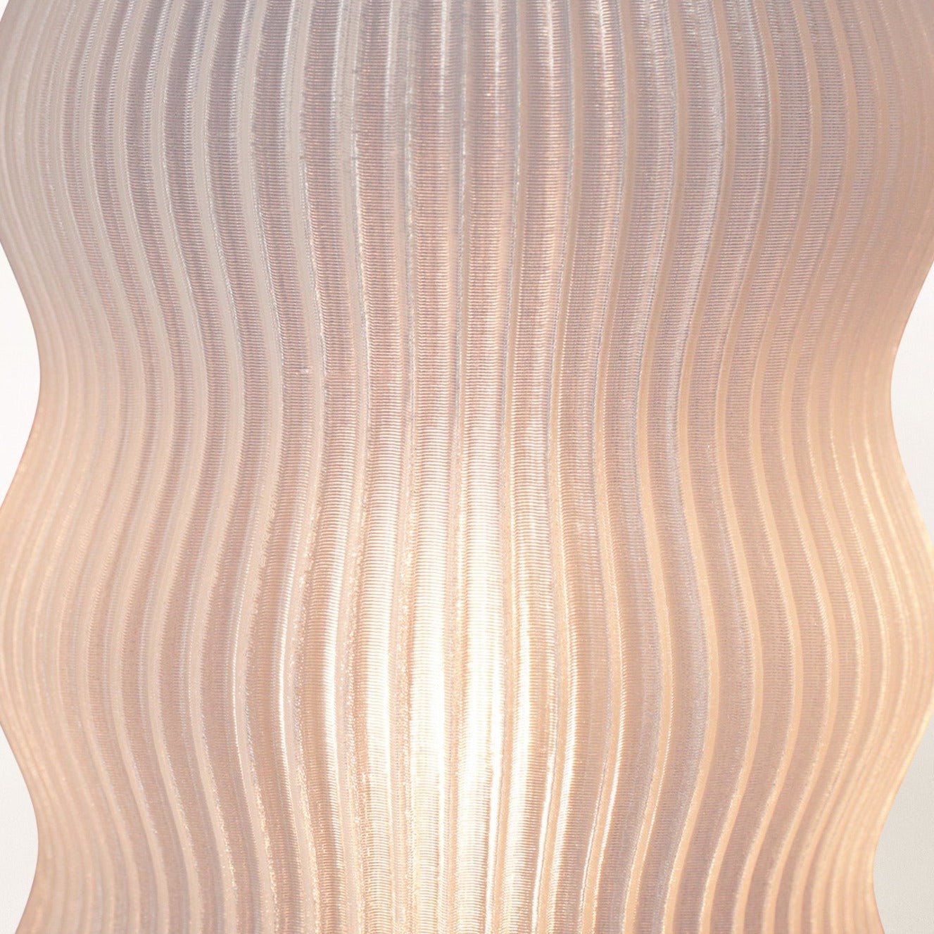 Yuji table lamp by Terra Labs featuring a modern design with a sleek base and a soft fabric lampshade.
