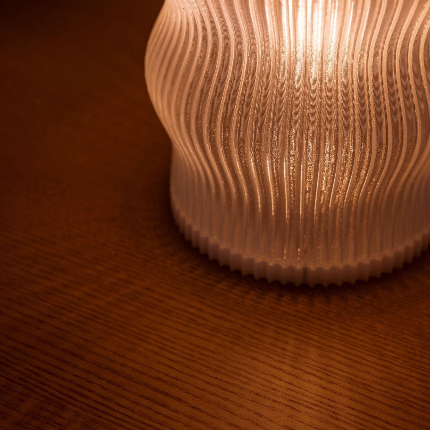 Terra Labs Yuji table lamp with a sleek modern design, featuring a cylindrical base and a soft fabric lampshade.