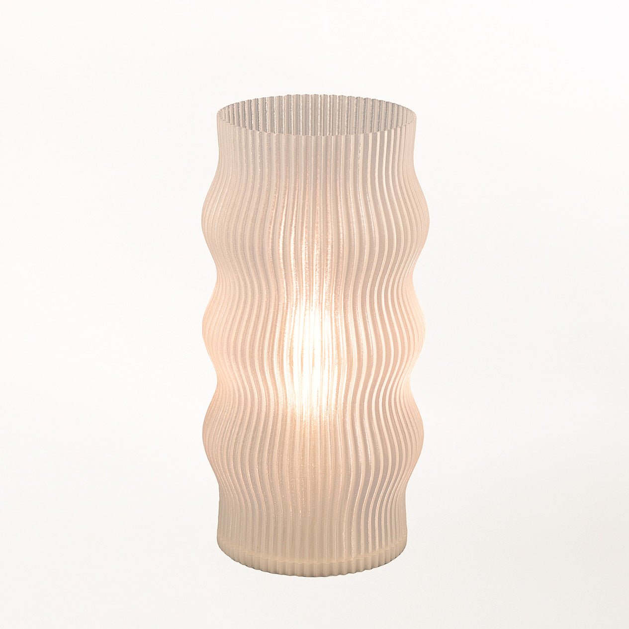 Yuji Table Lamp by Terra Labs with a sleek modern design, featuring a cylindrical base and a soft fabric lampshade.