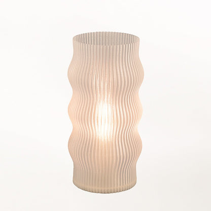 Yuji Table Lamp by Terra Labs with a sleek modern design, featuring a cylindrical base and a soft fabric lampshade.